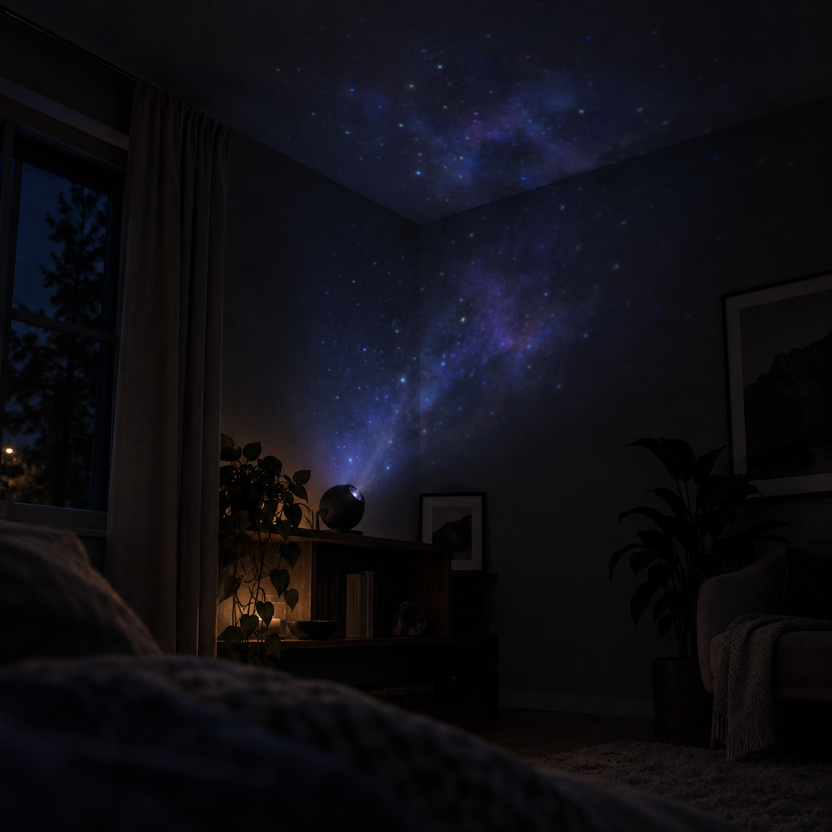 The projector casting a dim starfield across a dark bedroom wall